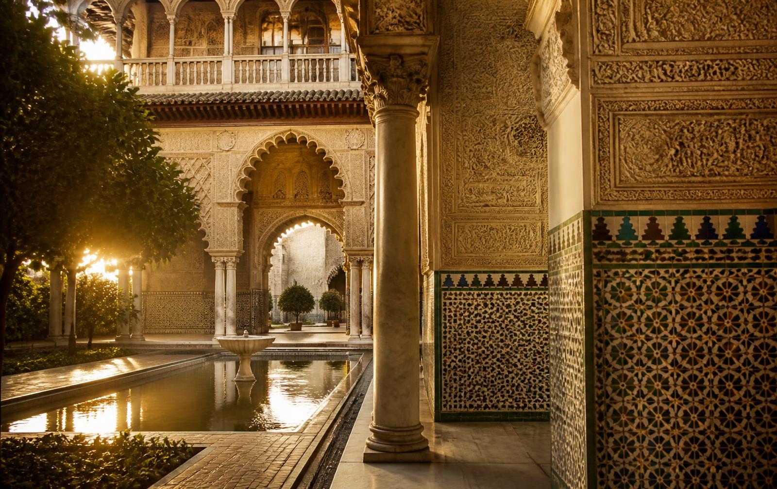 Courtyard, arches and reflecting pool of the Real Alcázar in Seville